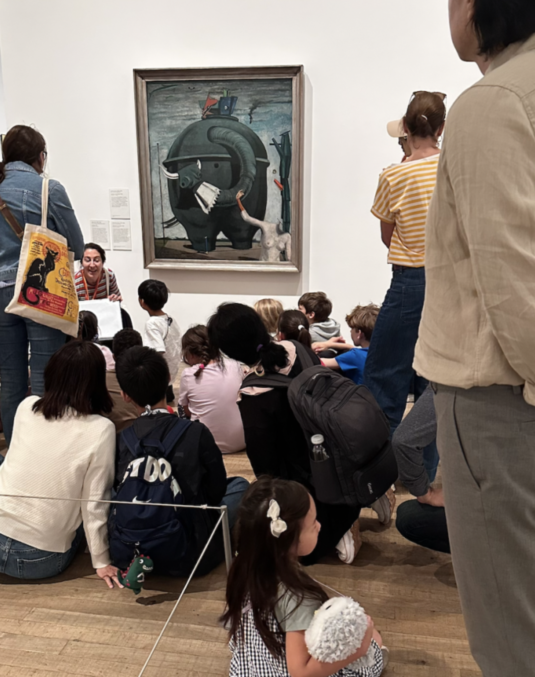 Children learning from artwork inside a museum in England during worldschooling